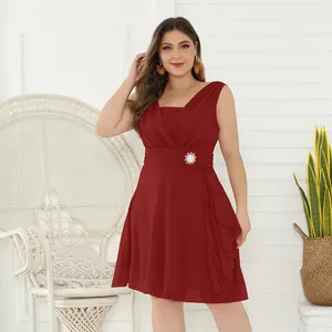 Detailed view of burgundy plus-size chiffon bridesmaid dress with rhinestone waist brooch.