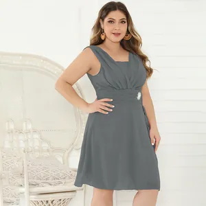 Elegant plus size grey cocktail dress with pleated bodice and brooch detail