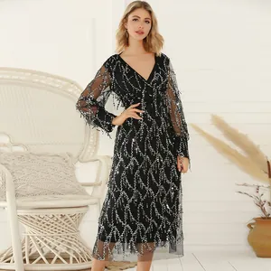 Elegant black V-neck dress with shimmering silver sequins and fringe details