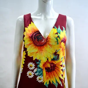 Detail of sleeveless bohemian V-neck dress with vibrant sunflower and daisy print