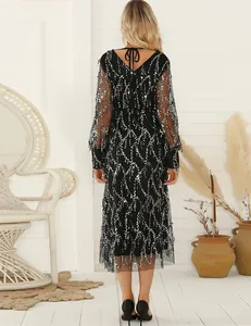 Detailed back view of an elegant black V-neck sequin evening dress with tassel fringe