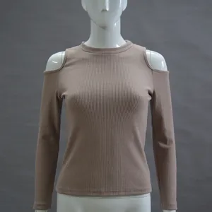 Close-up detail of beige ribbed long sleeve cold shoulder knit sweater for women