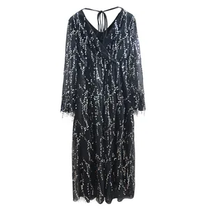 Detailed view of an elegant black V-neck evening gown featuring shimmering silver sequins