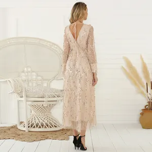 Elegant back view of a sequined midi dress with tassels and deep V-neckline