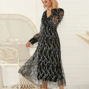 Elegant black V-neck dress with silver sequins and tassel hem for evening parties