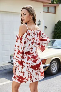 Detailed back view of a women's red and white tie-dye off-shoulder vacation mini dress