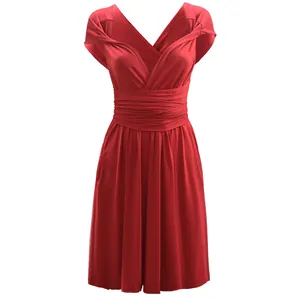 Detailed close-up of the red multi-way convertible dress with cinched waistline