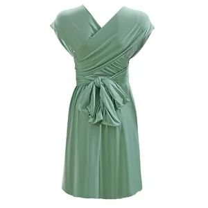 Back view of a sage green multi-way convertible infinity dress with bow detail.