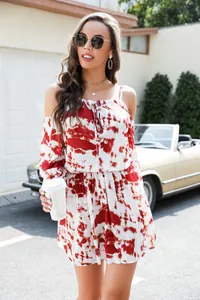 Close-up of tie-dye print off-the-shoulder dress with drawstring waist for summer.