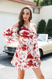 Detail view of the red and white tie-dye off-the-shoulder dress with elastic waist