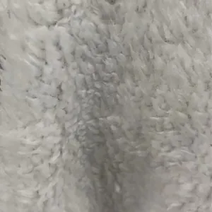Macro detail showing the soft white fleece texture of this warm winter women cardigan
