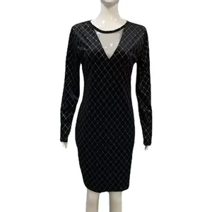 Detail of black velvet bodycon dress featuring rhinestone diamond pattern and mesh insert