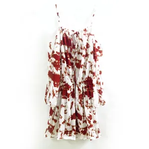 Close-up detail of tie-dye print mini dress with cold-shoulder sleeves and elastic waist design