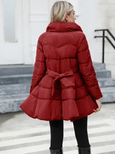 Back view detail of a red slim-fit quilted coat with a stylish bow waist design