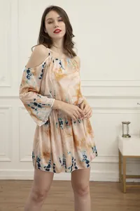 Detailed view of a bohemian tie-dye cold-shoulder summer mini dress with elastic waist.