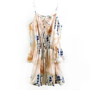 Detail showing the intricate tie-dye print and elastic waist of this mini dress