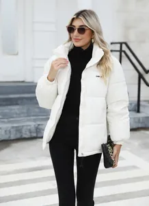 Modern white winter puffer jacket for women with high collar and warm quilted padding