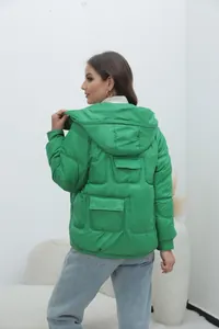 Detailed back view of a vibrant green hooded puffer jacket featuring quilted texture
