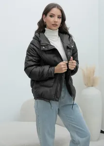 Detailed view of women's black thickened puffer jacket with stand collar and zip closure