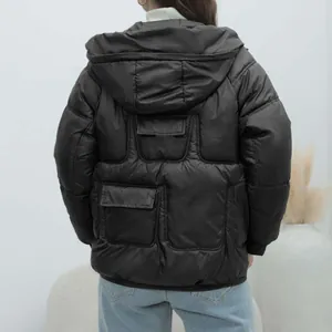 Back view of a stylish thick black hooded puffer jacket for women with padded quilting