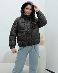 Full view of women's black hooded puffer jacket featuring unique rectangular quilting