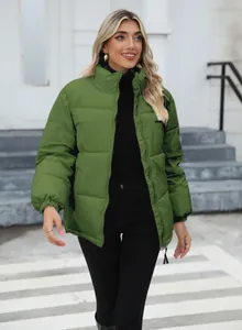 Close-up of a women's green puffer jacket with standing collar for winter warmth