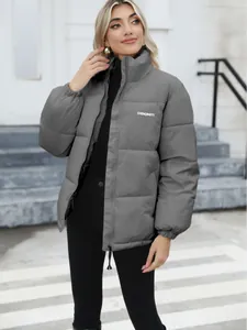 Chic grey women's winter puffer jacket featuring high collar and quilted design