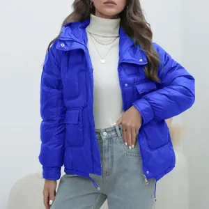 Detailed view of women's bright blue thick winter puffer jacket with stand-up collar