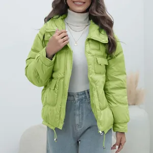 Detailed view of a bright lime green women's padded winter jacket featuring a stand collar.