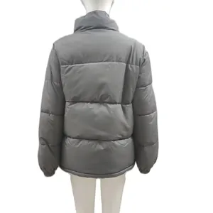 Detailed back view of a grey plus size women winter warm puffer jacket with quilted padding