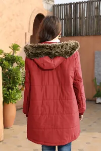 Back view of a warm red mid-length parka featuring a plush faux fur-trimmed hood