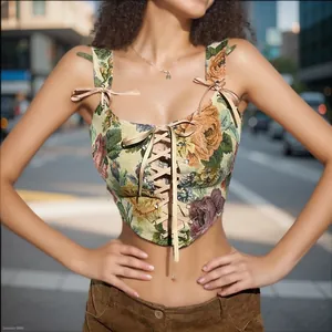 Close-up of vintage floral tapestry corset top with front lace-up and ribbon bows