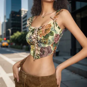 Detail view of a vintage floral corset crop top with front lace-up design and slim fit style