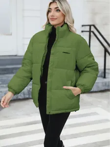 Stylish women's plus size green quilted puffer jacket featuring a warm stand collar for winter