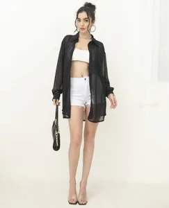 Full view of fashionable black sequined long-sleeve sheer shirt with lapel on model