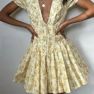 Detailed shot of a French retro floral mini dress with deep V-neck and puff sleeves
