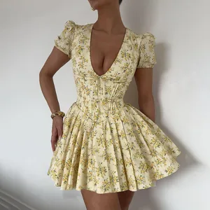 Close-up detail of a French vintage floral mini dress featuring puff sleeves and a V-neck.