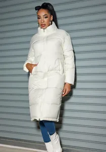 Detailed view of a white long quilted puffer jacket featuring a stand collar and zipper.