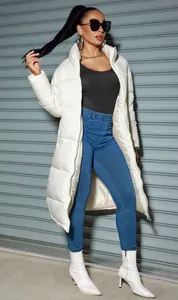 Elegant women's long white padded winter jacket featuring a stylish stand collar and zipper