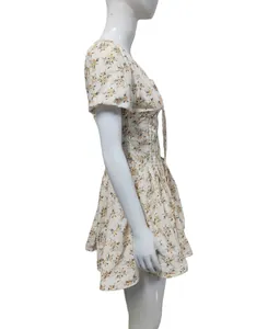 Side view of a vintage French floral puff sleeve dress with a flared skirt
