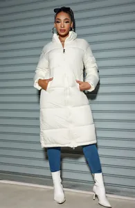 Front detail shot of a stylish white long-length puffer coat for women with a zipper closure