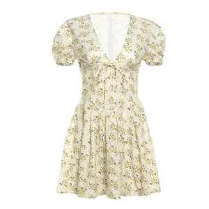 Detailed view of a French vintage floral dress with puff sleeves and V-neckline