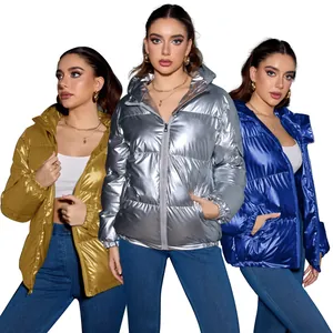 Detail of metallic glossy puffer jackets in gold, silver and blue colors