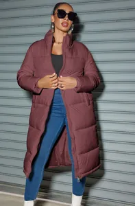 Stylish long maroon zip-up puffer jacket for women featuring a warm padded design