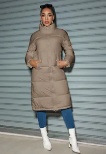 Full-length view of a women's long khaki puffer coat with a zipper closure for winter.