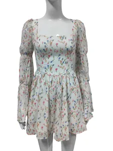 French vintage square neck floral mini dress with puffed sleeves on white mannequin