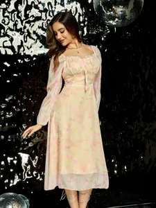 Elegante vestido midi floral de manga larga de estilo francés con detalle de lazo.