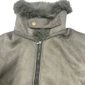 Detail view of a faux suede motorcycle jacket with fur collar and zipper detail.
