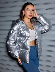 Stylish metallic silver hooded puffer jacket featuring a glossy finish worn by a model