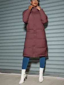Chic women's long winter puffer jacket with zipper closure in solid burgundy color